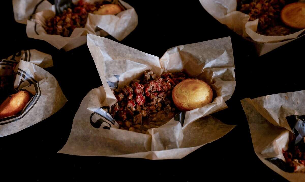 Visitors to the new 'Legacy of the Longhorn' show at the Cowtown Coliseum can partake in a lunch from the chuckwagon featuring brisket, beans and cornbread.